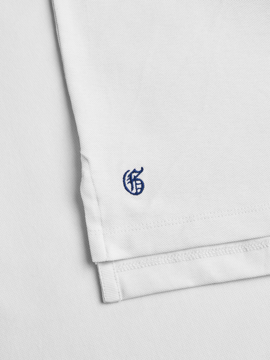 White shorts with a blue logo on a light gray background