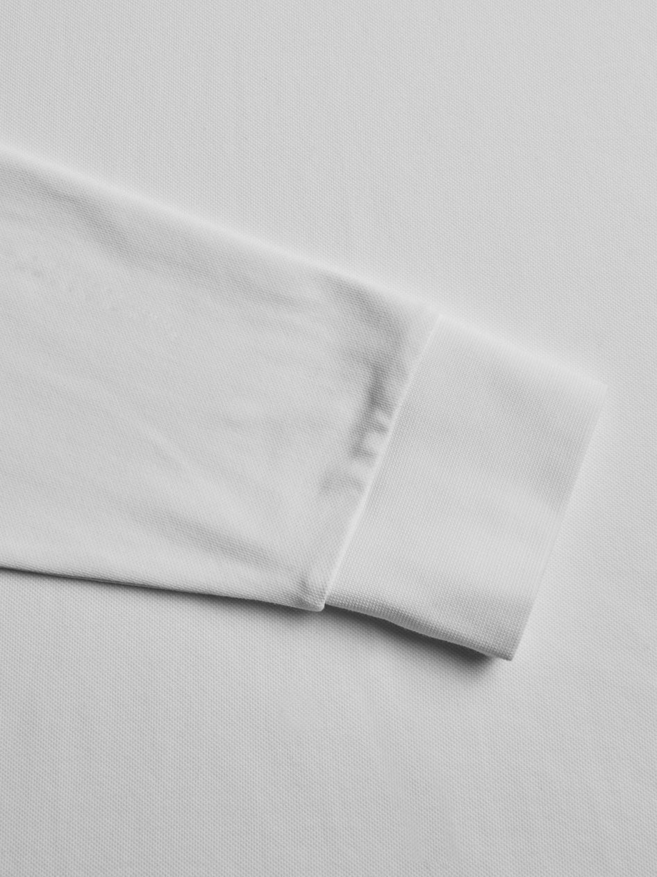 Close-up of a light gray fabric with a subtle texture on a matching background